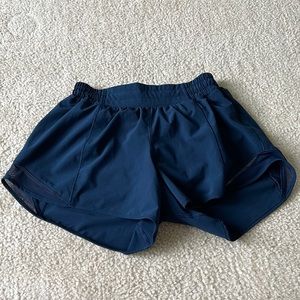 Lululemon Hotty Hot low-rise 4 in. Color is True Navy.